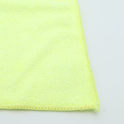 Close-up of a yellow microfiber cloth on a white background