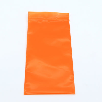Orange plastic bag on a white background