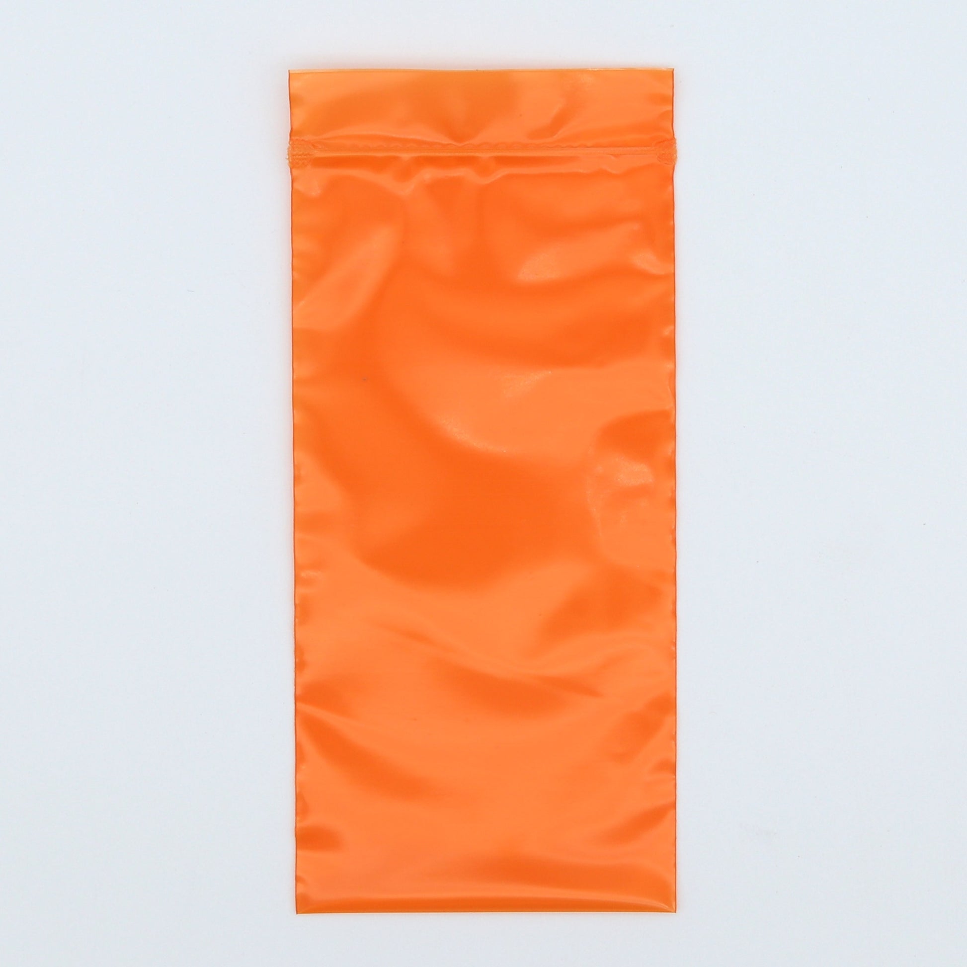 Orange towel on a light gray background