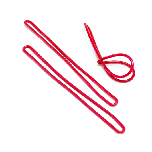 Red metal flexible plastic loops on a white background