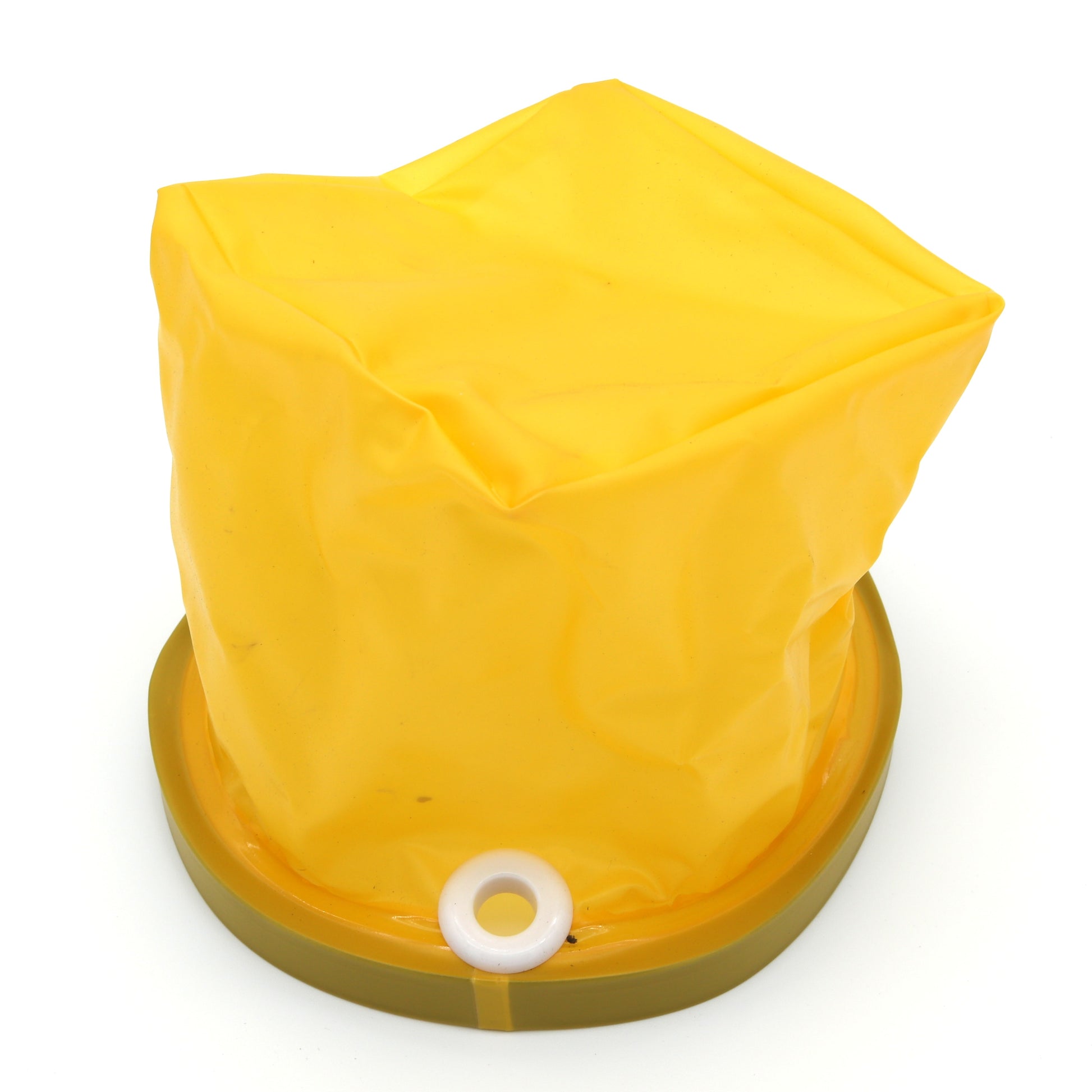 Yellow plastic bag with a white ring on a white background