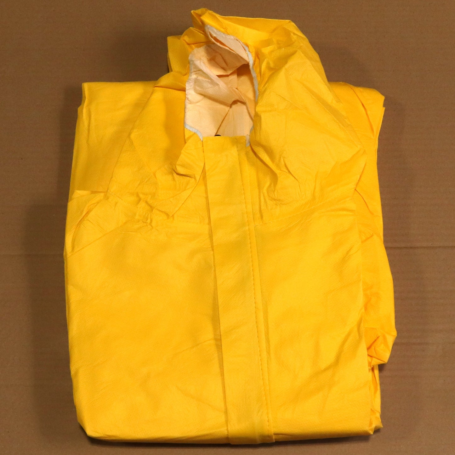 Yellow raincoat on a brown background