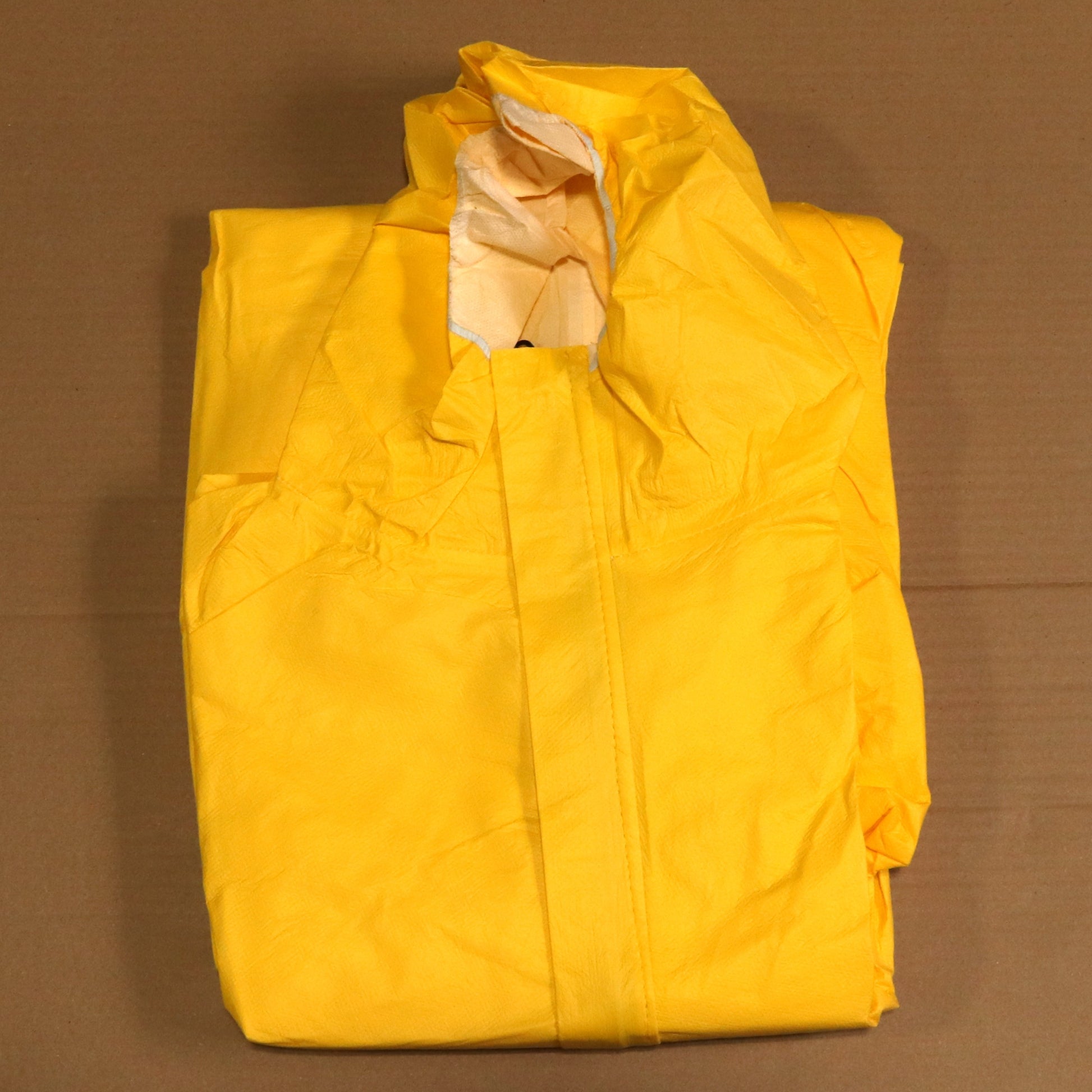 Yellow raincoat on a brown background