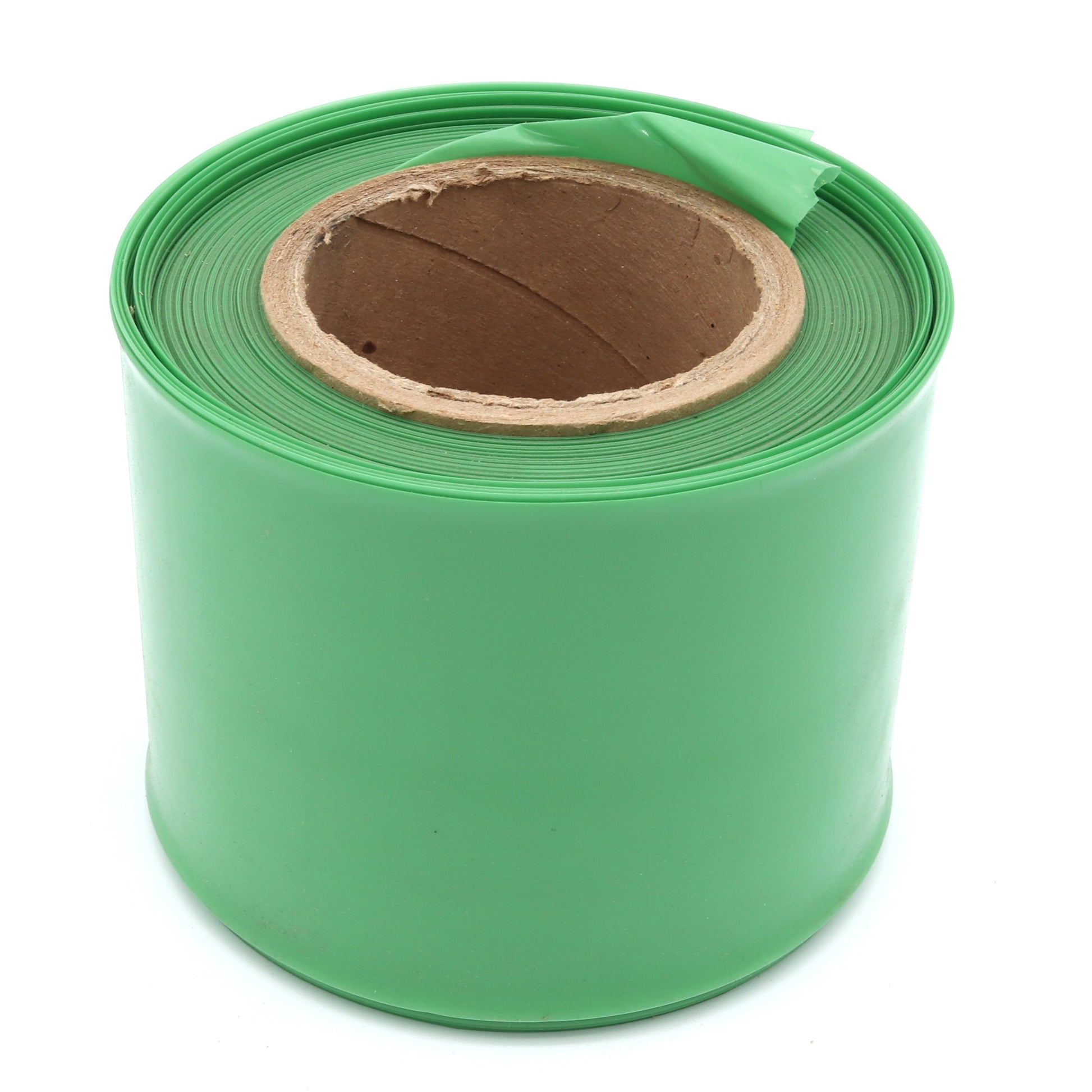 Roll of green plastic sheeting on a white background