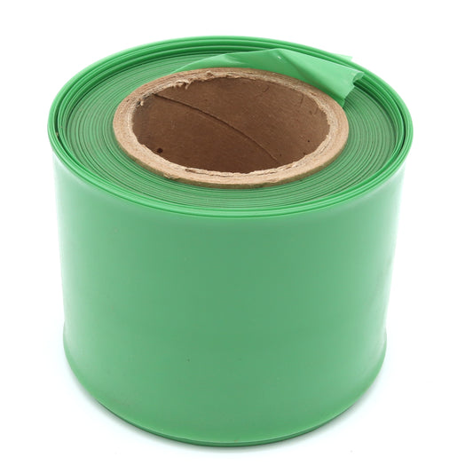 Roll of green plastic sheeting on a white background