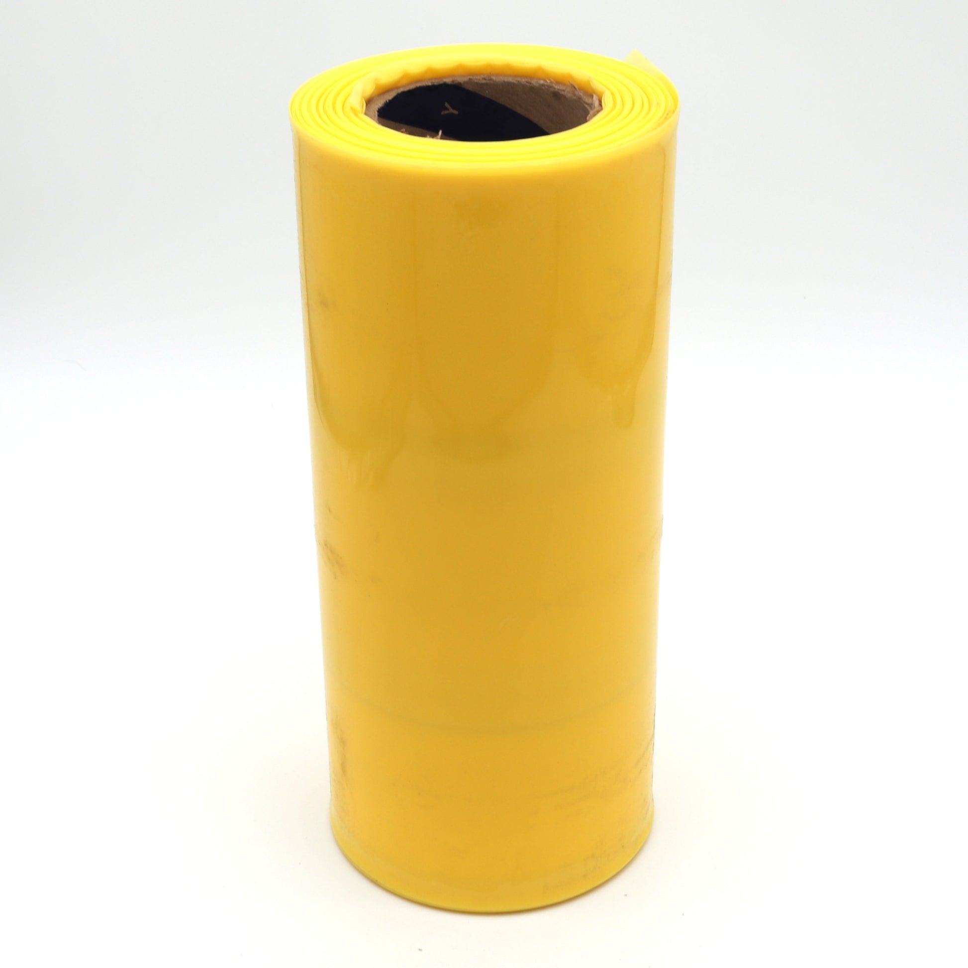 Roll of yellow material on a white background