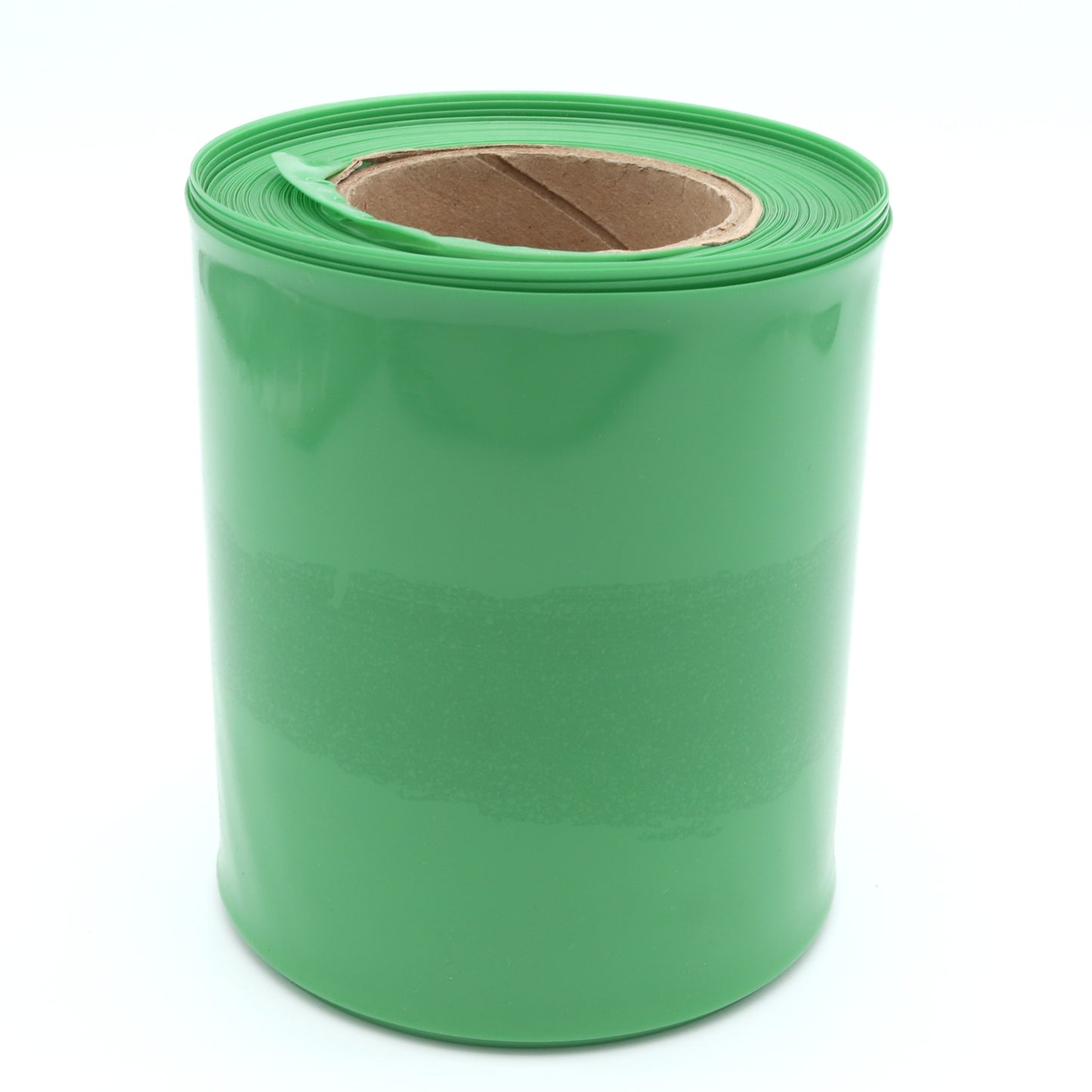 Green roll of plastic sheeting on a white background