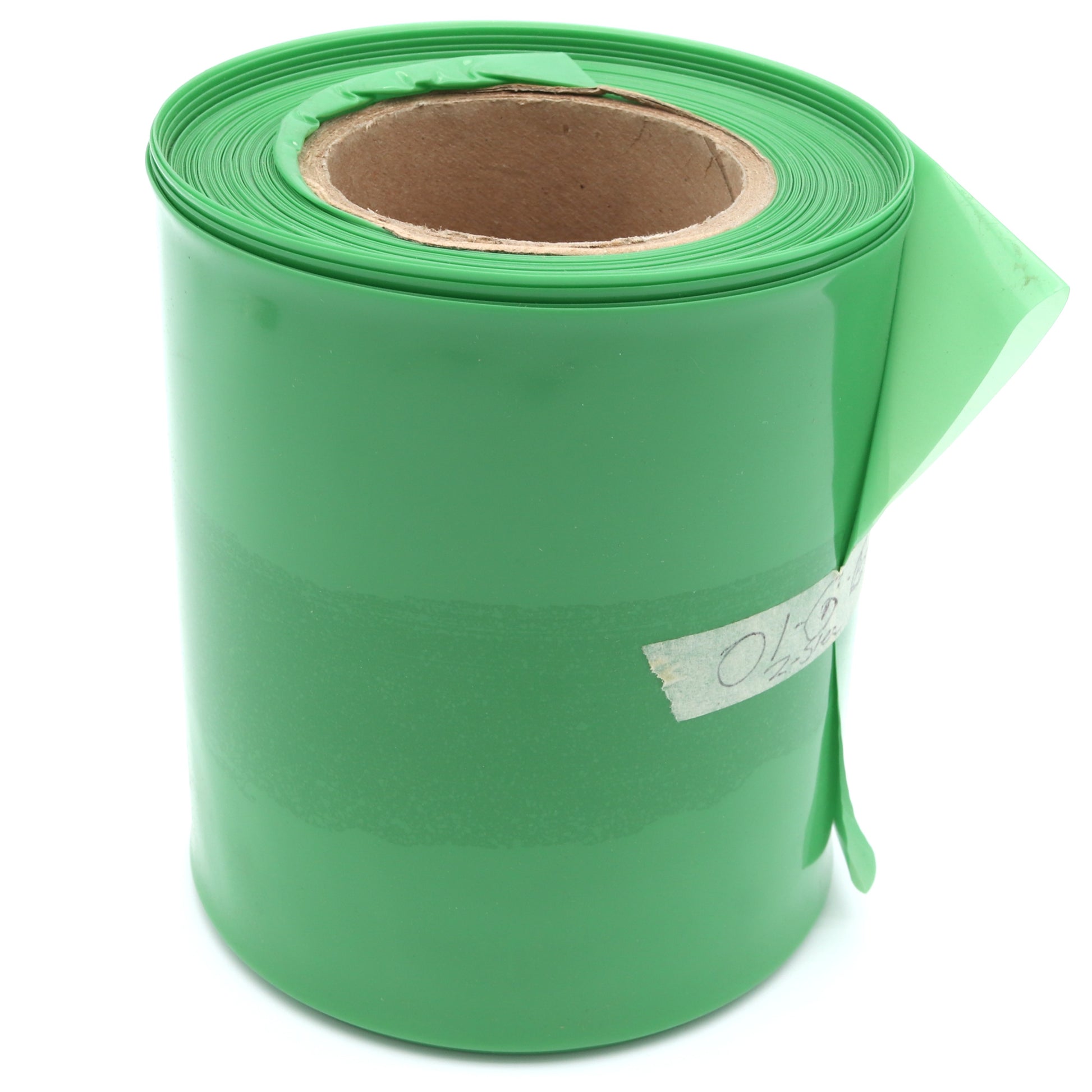 Roll of green paper with a visible brand label on a white background