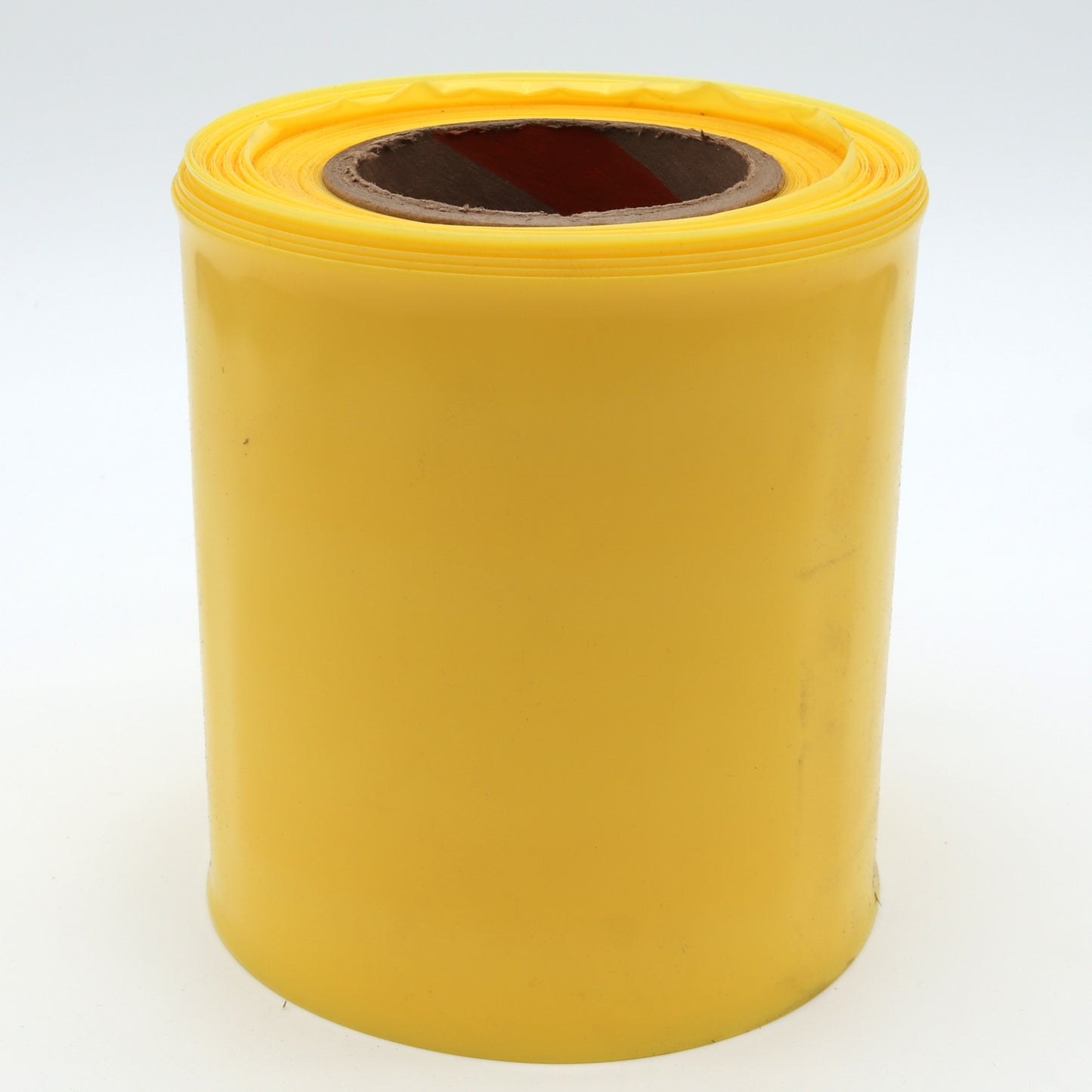 Yellow roll of paper on a white background