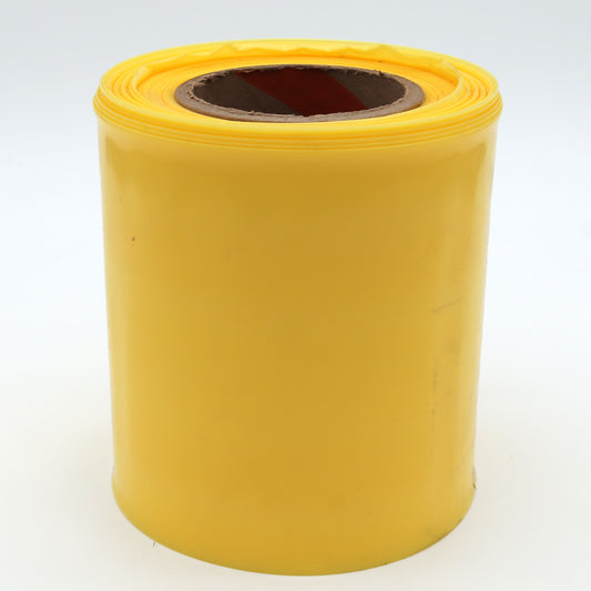 Yellow roll of paper on a white background