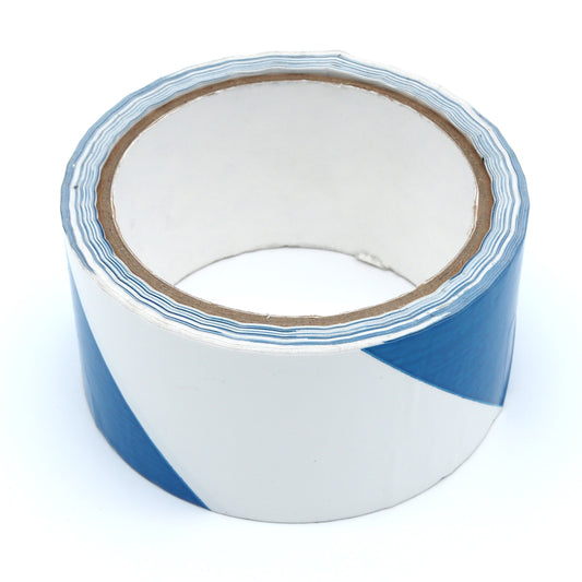 Roll of blue and white striped tape on a white background