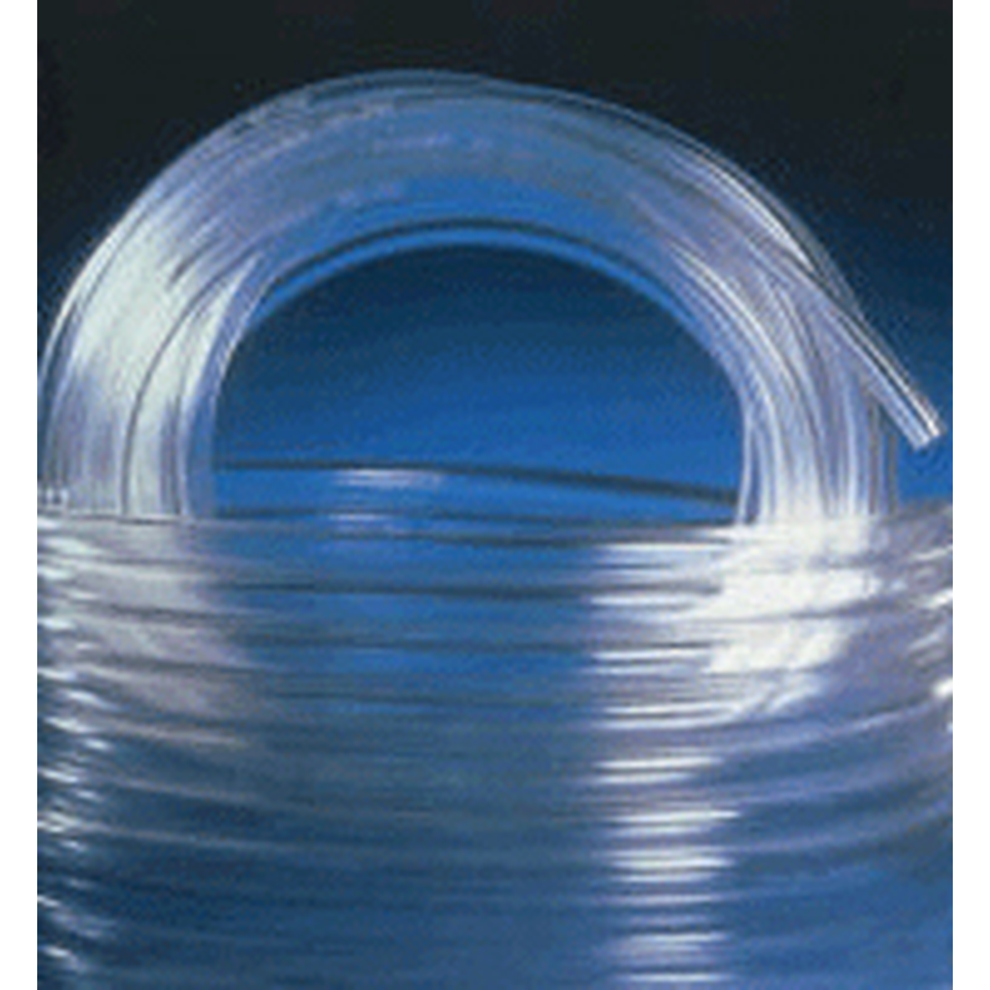 Coiled clear plastic tubing against a dark background